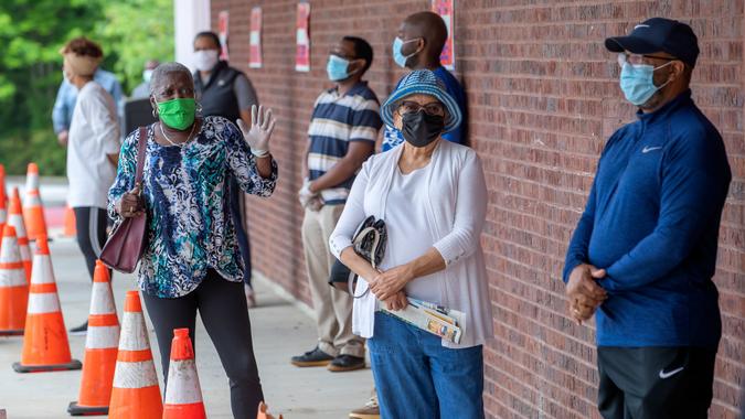 Mandatory Credit: Photo by ERIK S LESSER/EPA-EFE/Shutterstock (10650941l)People wait in line to cast their ballots as early voting begins for three primaries and elections, at the C.
