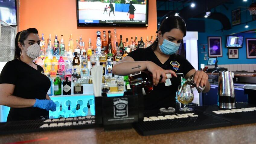 Mandatory Credit: Photo by JLN Photography/Shutterstock (10651280d)Juana's Latin Sports Bar & Grill bartenders preparing a drink for a customer.