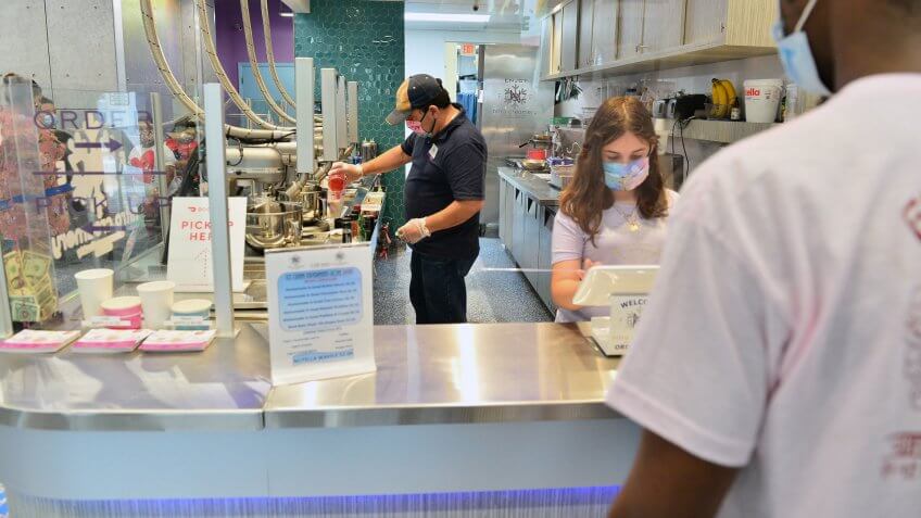 Mandatory Credit: Photo by JLN Photography/Shutterstock (10651280j)Customers can be seen dining on the first day at Freze N nitro creamery ice cream is being serve by owner Edward Gassed and 10 years old daughter Olivia for re-opens for indoor dining on May 18, 2020 in Miramar, Florida.