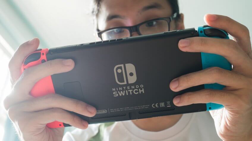 guy playing Nintendo Switch