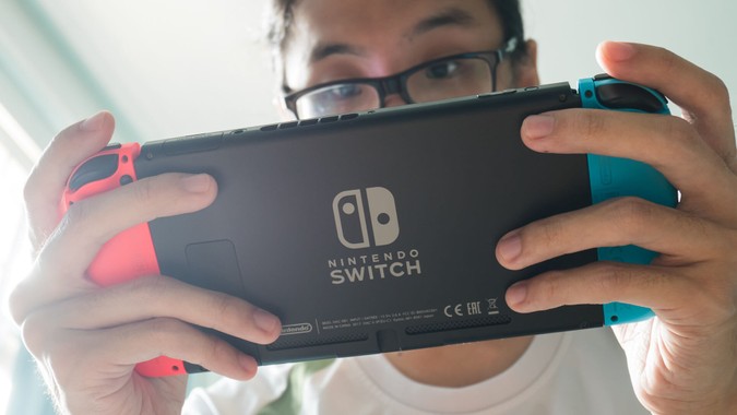 guy playing Nintendo Switch