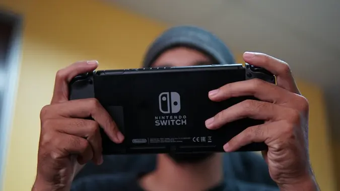 guy-playing-nintendo-switch-shutterstock_638228764.jpg
