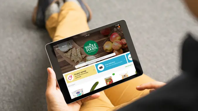 man using Instacart grocery delivery app on tablet