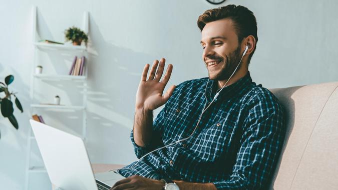 man with earphones for job interview man with earphones for job interview working remotely.