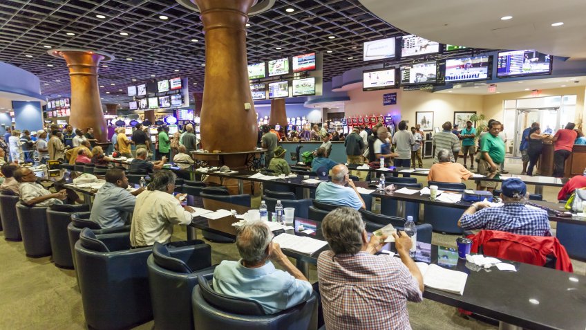 HALLANDALE BEACH, USA - MAR 11, 2017: People betting and gambling in the Gulfstream park casino in Hallandale Beach.