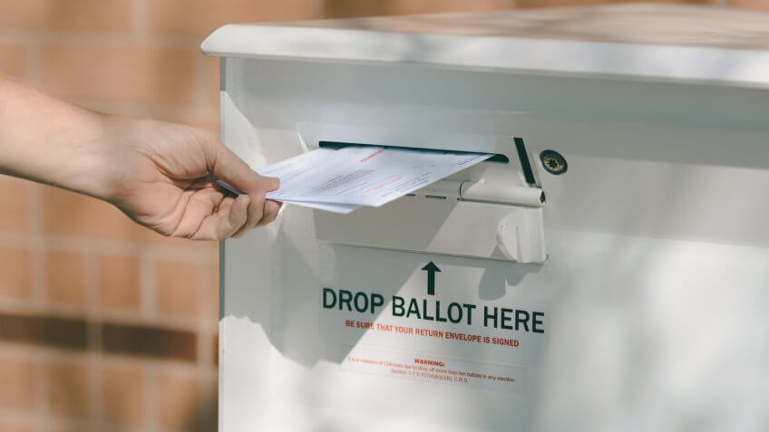 Arvada, Colorado, USA - October 23, 2016: Hand delivering ballots to Jefferson County Drop Off Ballot Box.