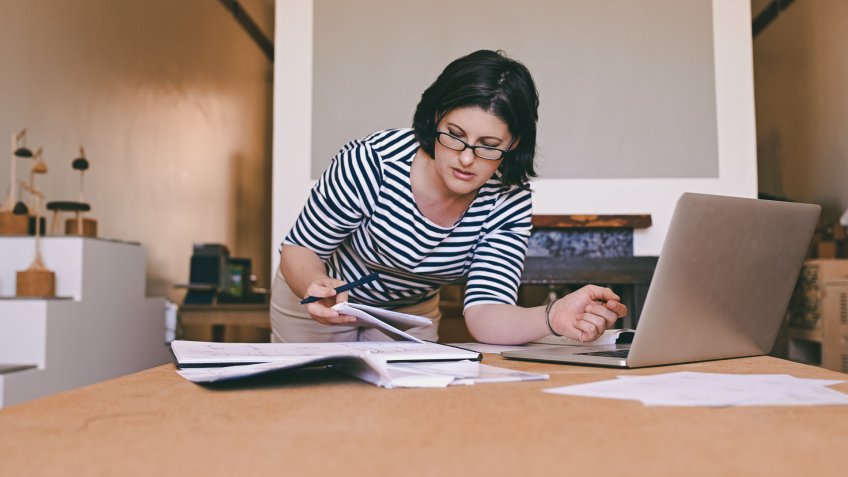 woman working at home preparing