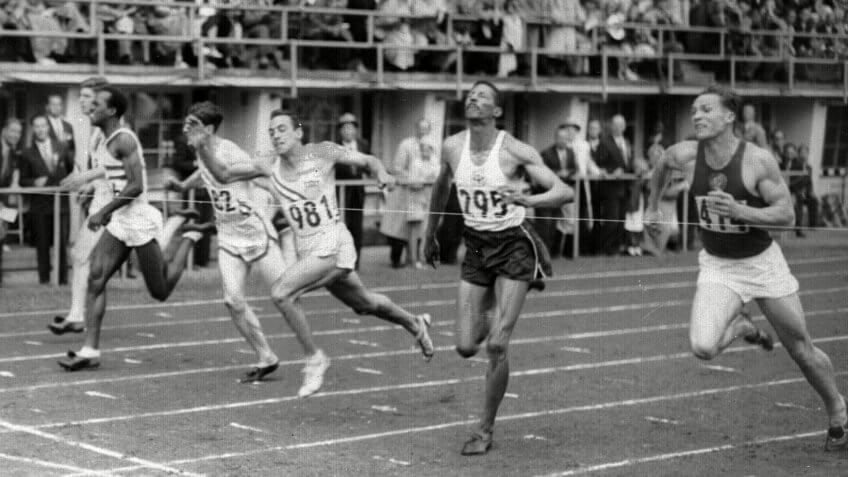 LINDY REMIGINO Lindy Remigino (981) of New York wins the 100-meter final in Olympic games at Helsinki, Finland, in the closest finish of the event in years.