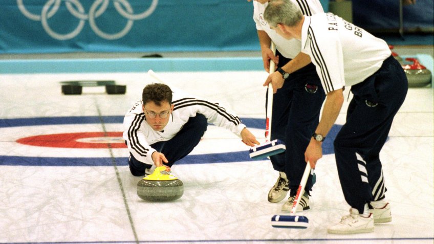 Great Britain skip Douglas Dryburgh releases his stone as Philip Wilson & John Napier prepare to sweep Mens Curling 09/02/1998 Winter Olympics 1998 Japan NaganoSport.