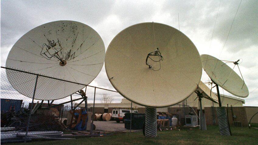 Mandatory Credit: Photo by Toby Talbot/AP/Shutterstock (7192591a)ADELPHIA FILE--Satellite dishes point skyward at the Adelphia Communications offices in Berlin, Vt.