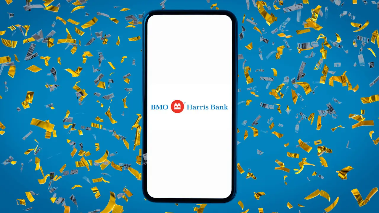 Dark blue background covered with multi-colored confetti and a smartphone displaying the BMO Harris Bank logo