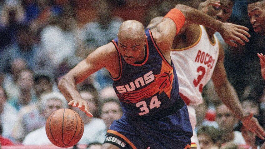Phoenix Suns Charles Barkley (34) drives down the court passing Houston Rockets Otis Thorpe, behind, during the first quarter on in Houston.