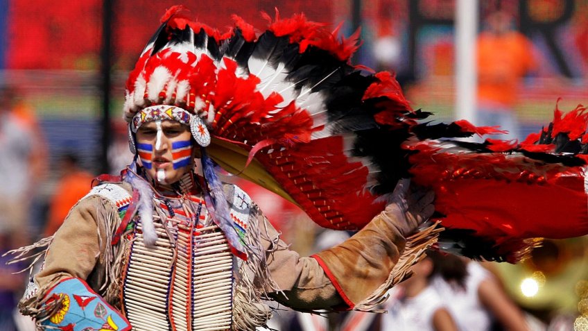Mandatory Credit: Photo by Seth Perlman/AP/Shutterstock (6390045b)Chief Illiniwek University of Illinois' Mascot Chief Illiniwek preforms during the University of Illinois football game in Champaign, Ill.