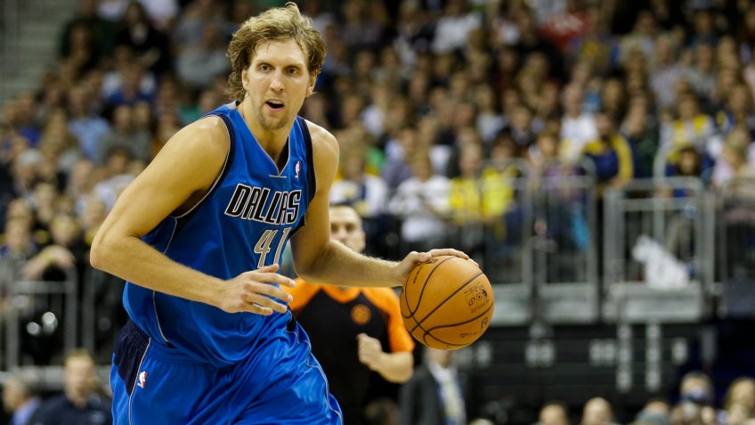 Dirk Nowitzki, Rick Carlisle Dallas Mavericks' Dirk Nowitzki, left, plays the ball as Mavericks head coach Rick Carlisle, right, looks on during an exhibition basketball game against Alba Berlin in BerlinGermany Mavericks Alba Berlin Basketball, Berlin, Germany.