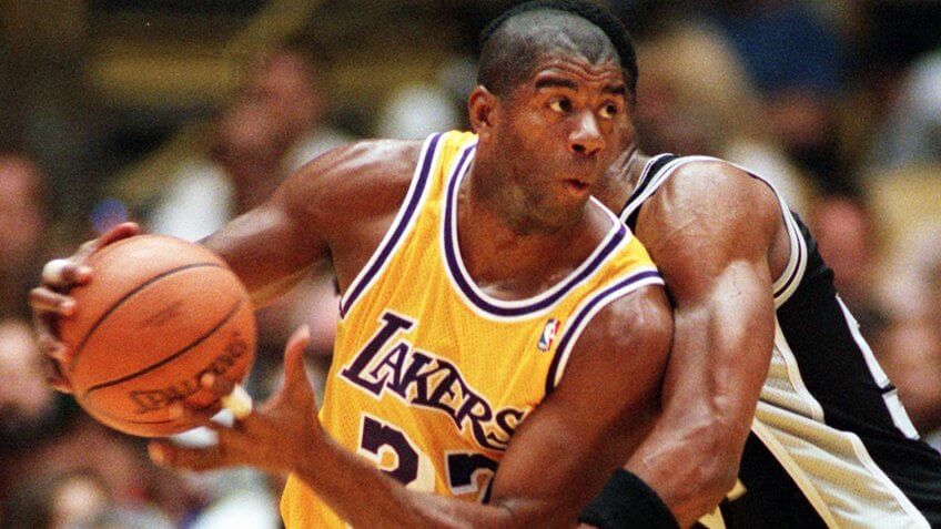 SMITH JOHNSON Los Angeles Lakers' Earvin "Magic" Johnson spins around a pick thrown by San Antonio Spurs' Charles Smith during the first quarter, in Inglewood, Calif.