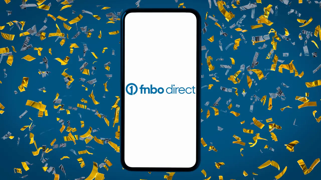 Dark blue background covered in yellow confetti with a phone on top displaying the FNBO Direct bank logo