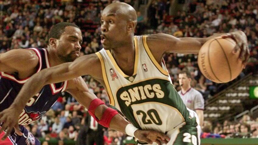 PAYTON MOBLEY Seattle SuperSonics' Gary Payton drives against Houston Rockets' Cuttino Mobley during the third quarter in Seattle, .