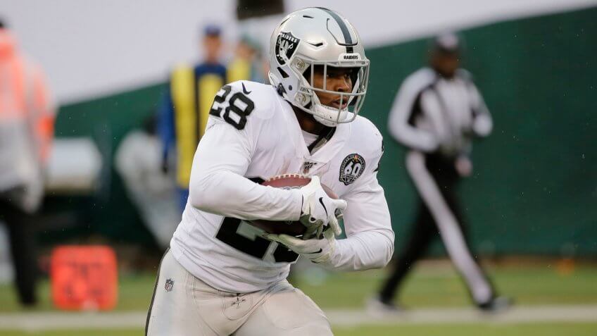Mandatory Credit: Photo by Seth Wenig/AP/Shutterstock (10484323a)Oakland Raiders running back Josh Jacobs (28) runs with the ball during the first half of an NFL football game against the New York Jets, in East Rutherford, N.
