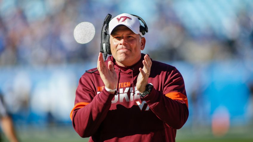 Virginia Tech head coach Justin Fuente reacts after his team scores against Kentucky in the first half of the Belk Bowl NCAA college football game in Charlotte, N.
