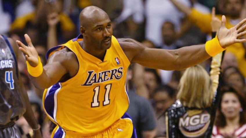 MALONE FINLEY Los Angeles Lakers' Karl Malone, right, looks for the foul call after scoring against Dallas Mavericks' Michael Finley during the fourth quarter, at the Staples Center in Los Angeles.