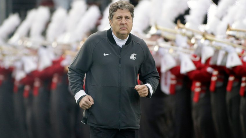 Washington State head coach Mike Leach runs onto the field before an NCAA college football game against Stanford, in Pullman, Wash.
