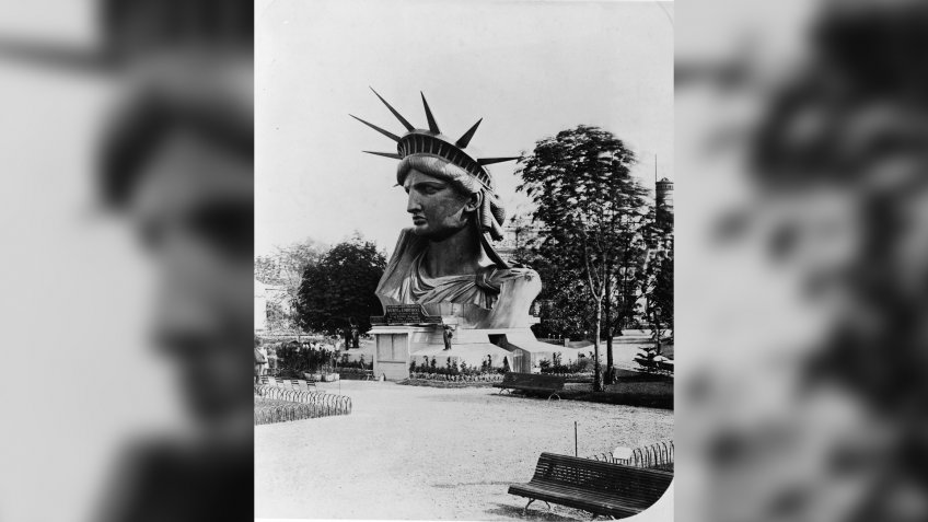 The head of the Statue of Liberty on display in the garden at the Champ de Mars at the World's Fair in Paris to drum up support and contributions for the completion of the great project, 1878.
