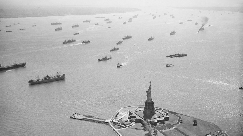 Labor unions; strikes; commerce Merchant ships lie at anchor in front of the Statue of Liberty in New York Harbor, .