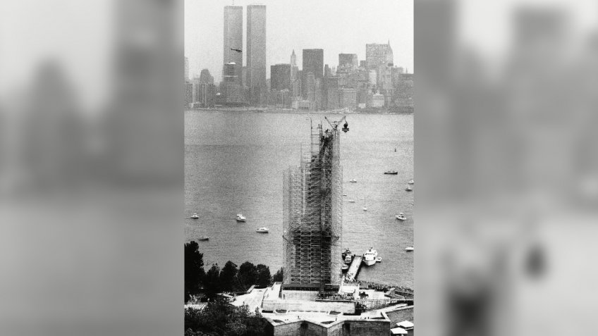 National monuments; New York Harbor; scaffolding The torch dangles above the Statue of Liberty after it was removed from her grasp in New York, .