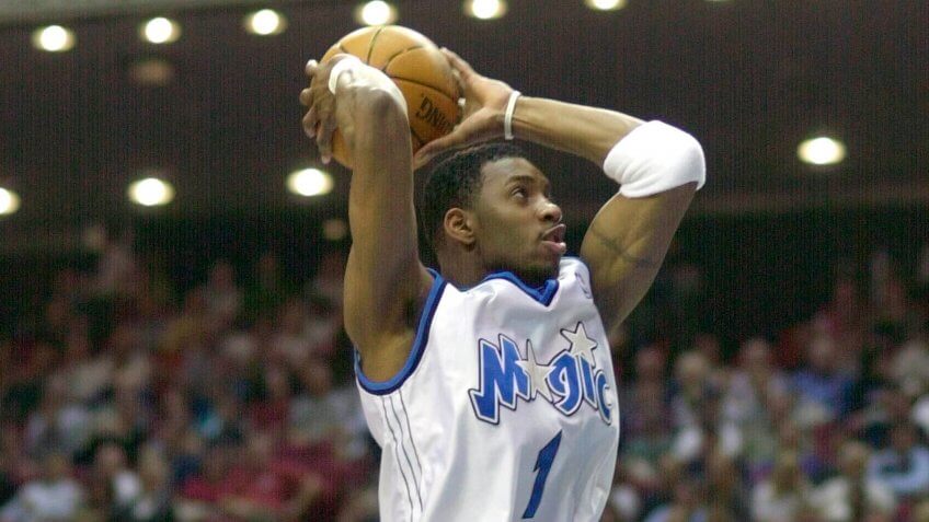 MOHAMMED MCGRADY VAUGHN Orlando Magic's Tracy McGrady prepares to dunk the ball in the first period as Atlanta Hawks' Nazr Mohammed, left, defends and Hawks' Jacque Vaughn looks on in Orlando, FlaHAWKS MAGIC, ORLANDO, USA.