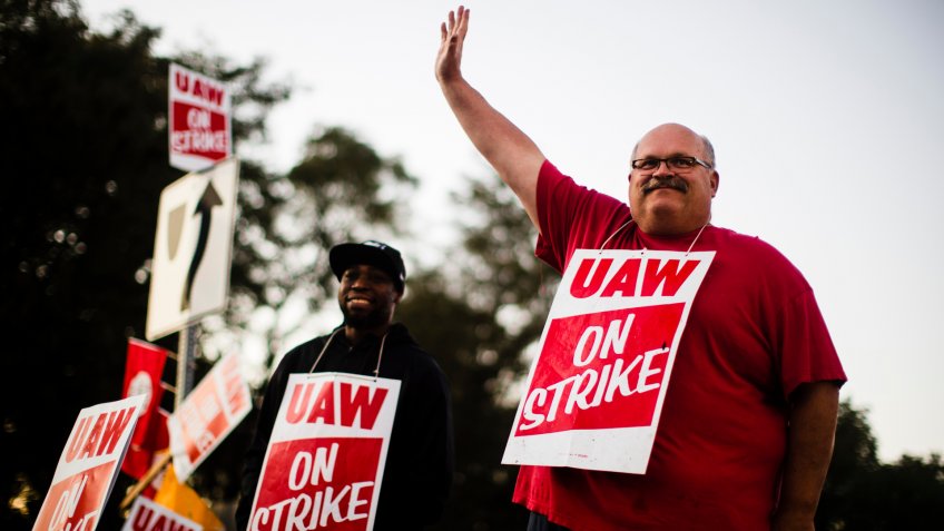 Mandatory Credit: Photo by Matt Rourke/AP/Shutterstock (10447513a)Workers Omar Glover, left, and Ray Gaeth picket outside a General Motors facility in Langhorne, Pa.