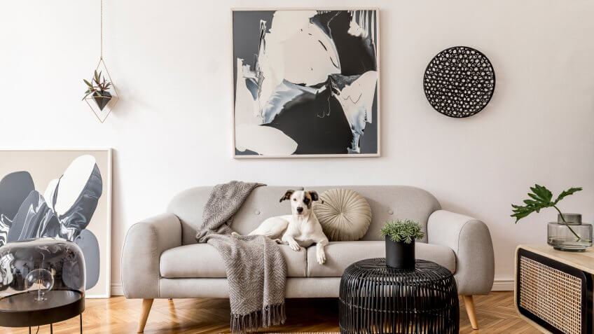 Interior design of living room at nice scandinavian apartment with stylish furnitures and elegant accessories.