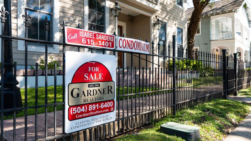 New Orleans, USA - April 23, 2018: Real estate for sale sign by realtor broker of apartment condominium in Garden district of Lousiana city.