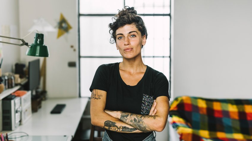 Portrait of confident female freelance artist looking at camera, she has financial freedom to do what she likes.