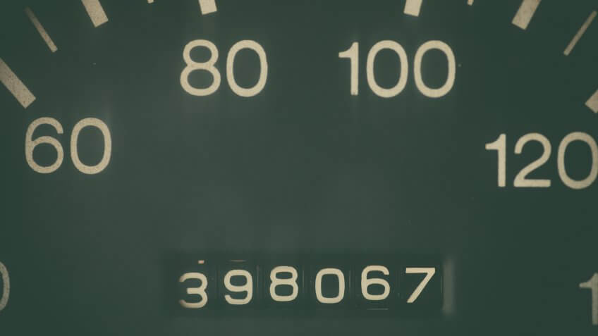 Car odometer showing a very high mileage.