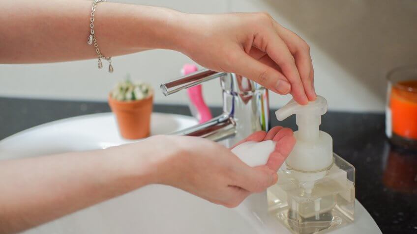 woman using foam soap pump