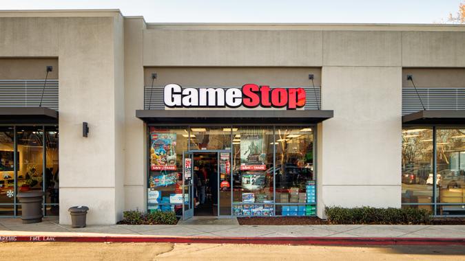 Entrance facade of the Gamestop video game store in a mall with sign, photographed in San Jose, California on Boxing Day.