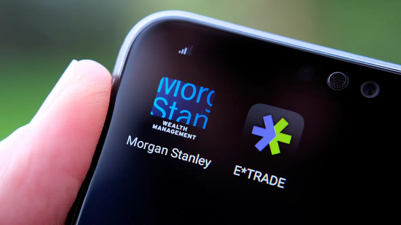 Stone / United Kingdom - February 23 2020: Morgan Stanley and E*TRADE apps seen on the smartphone screen hold in a hand.