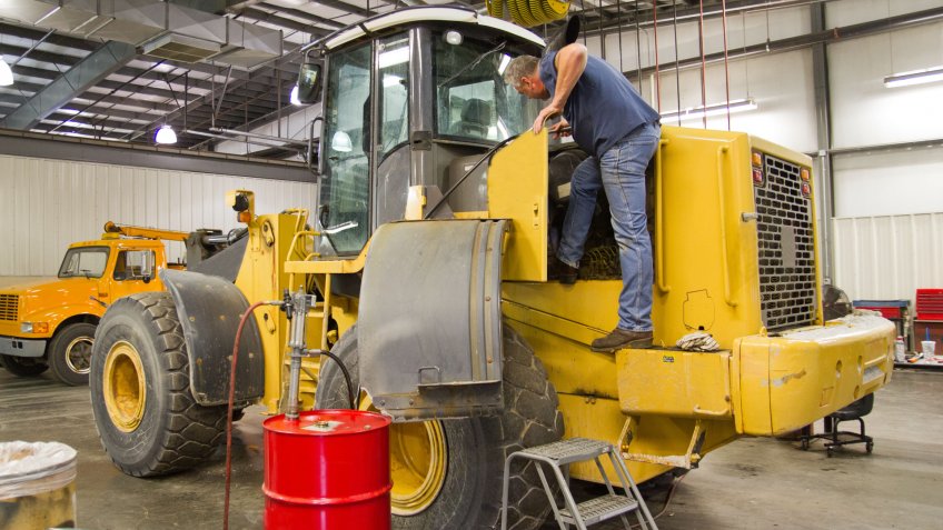 Heavy equipment requires a mechanic to climb on the machine to check oils, filters and make repairs.