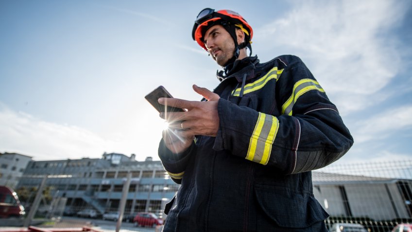Firefighters in a rescue operation training; all logos removed.