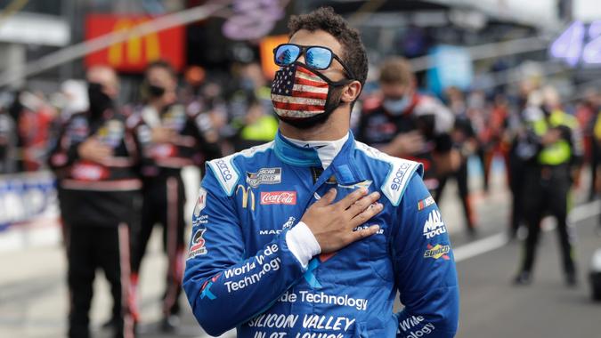 Mandatory Credit: Photo by Darron Cummings/AP/Shutterstock (10702659cl)Cup Series driver Bubba Wallace (43) stands during the national anthem before a NASCAR auto race at Indianapolis Motor Speedway in IndianapolisNASCAR Auto Racing, Indianapolis, United States - 05 Jul 2020.