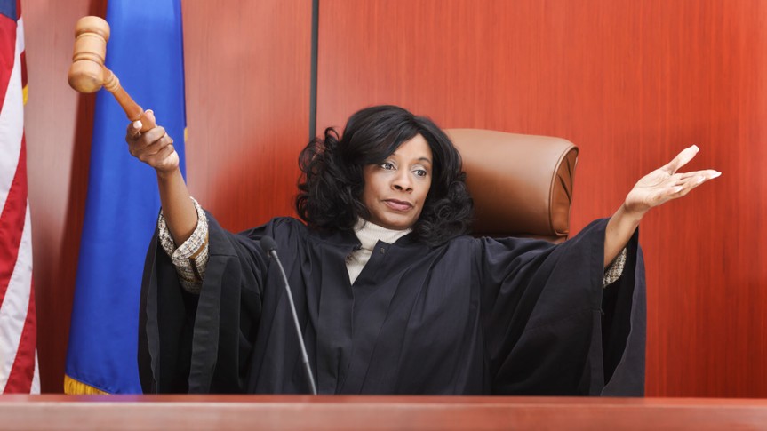 An African American female judge in the courtroom.