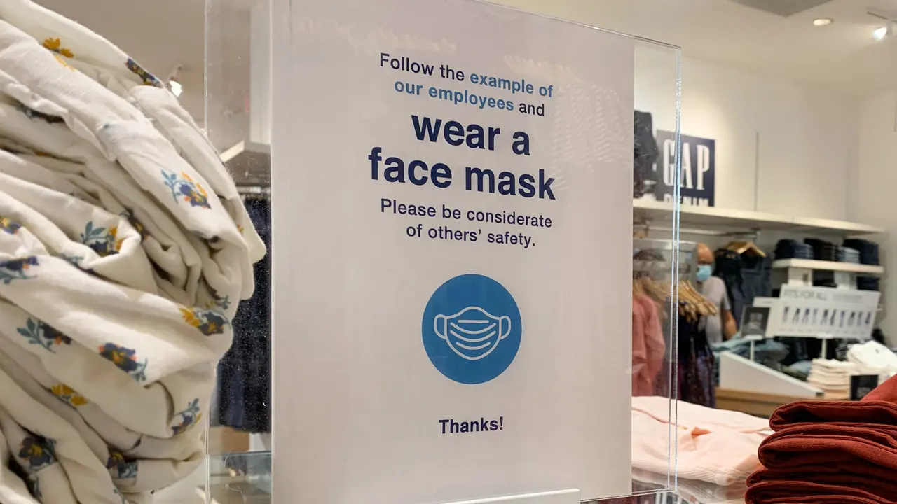 Phoenix, Arizona, June 18, 2020: Face Mask Sign in a Gap Retail Store during the reopening of stores during the Covid 19 Pandemic.