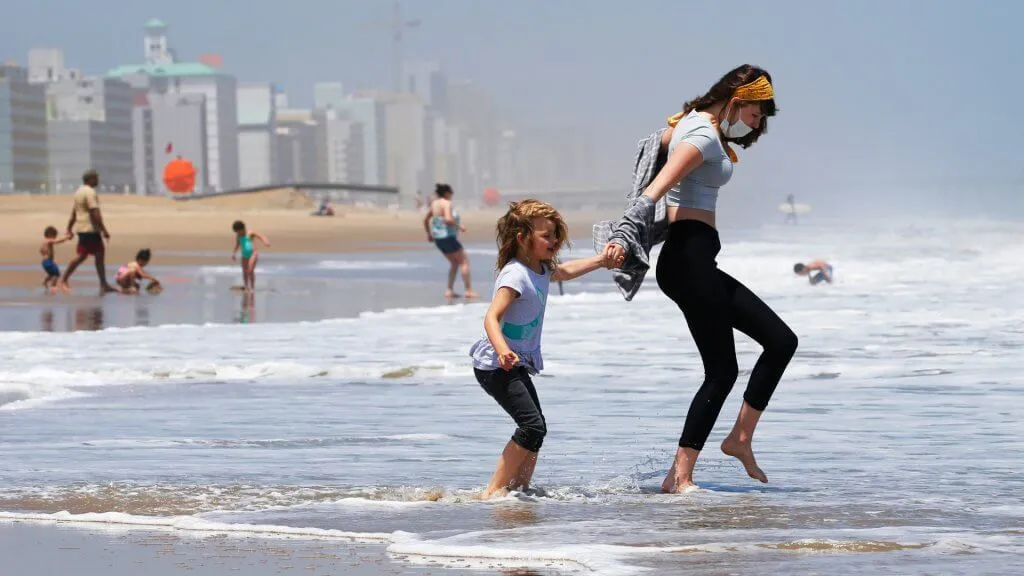 Mandatory Credit: Photo by Steve Helber/AP/Shutterstock (10690126a)Victoria Faughnan, right, and Evelyn Faughnan, play in the surf in Virginia Beach, Va.