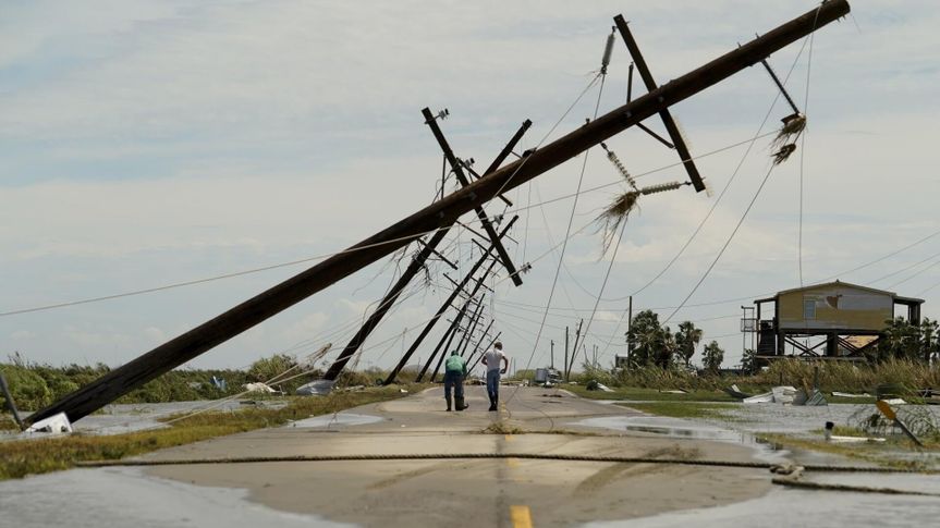 Mandatory Credit: Photo by Eric Gay/AP/Shutterstock (10757636n)People survey the damage left in the wake of Hurricane Laura, in Holly Beach, LaTropical Weather Louisiana, Holly Beach, United States - 27 Aug 2020.
