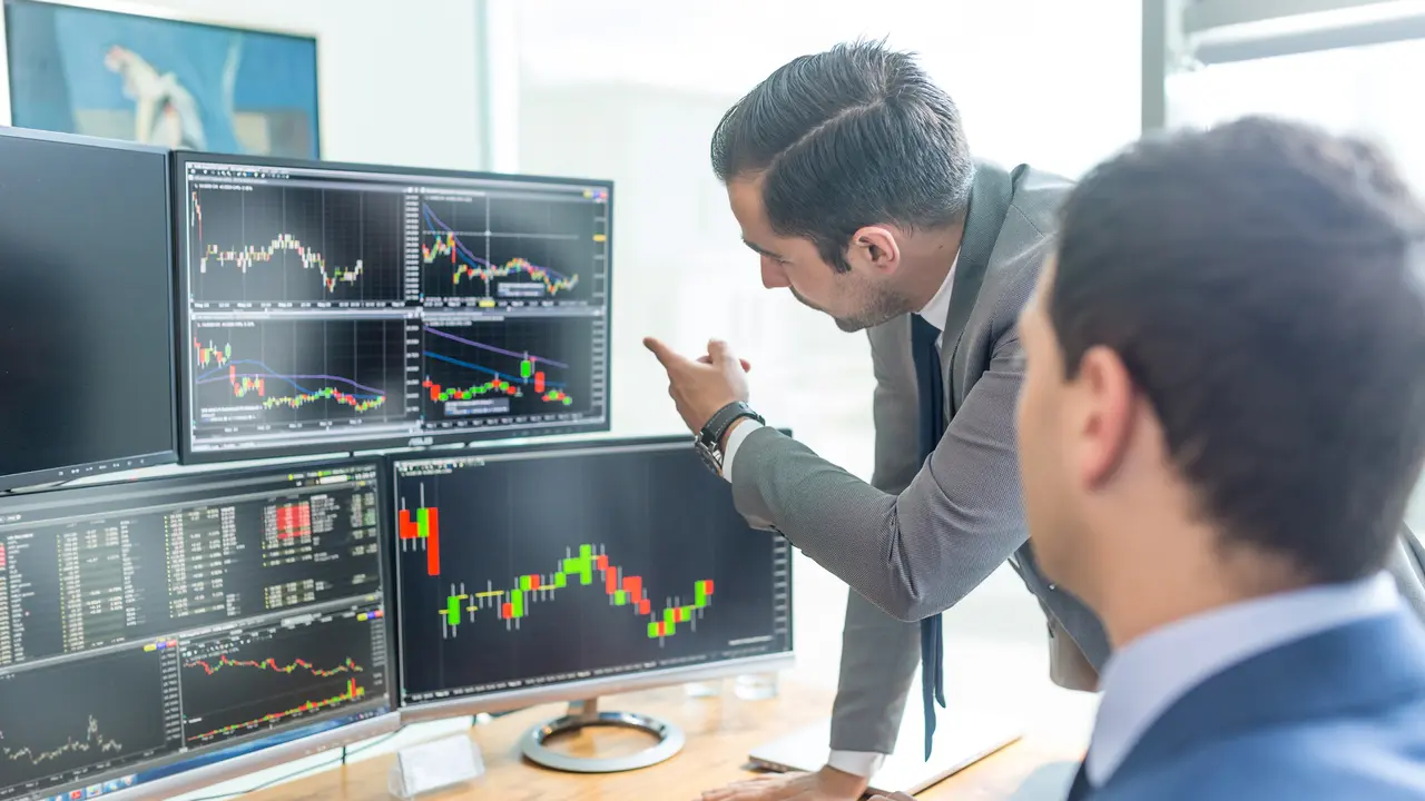 Businessmen Analyzing Stock Charts Online