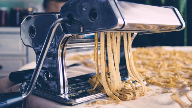Fresh homemade Fettuccine, pasta  on the kitchen table, selective focus.