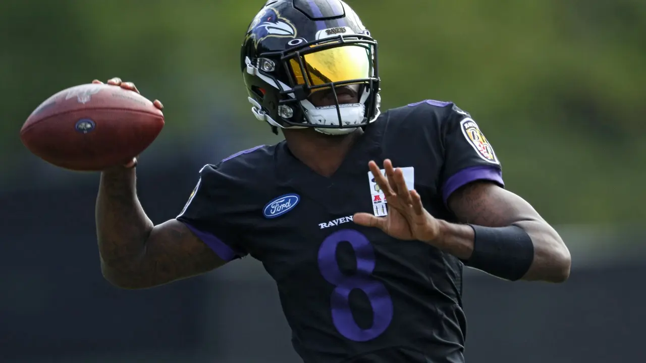 OWINGS MILLS, MARYLAND - AUGUST 17: Quarterback Lamar Jackson #8 of the Baltimore Ravens throws a pass during the Baltimore Ravens Training Camp at Under Armour Performance Center Baltimore Ravens on August 17, 2020 in Owings Mills, Maryland.
