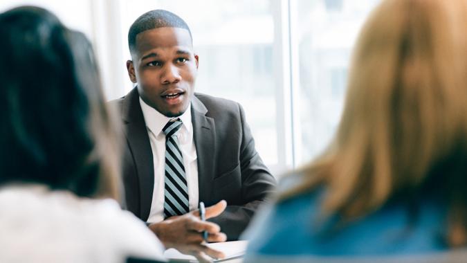 Two women at a meeting with a financial advisor.