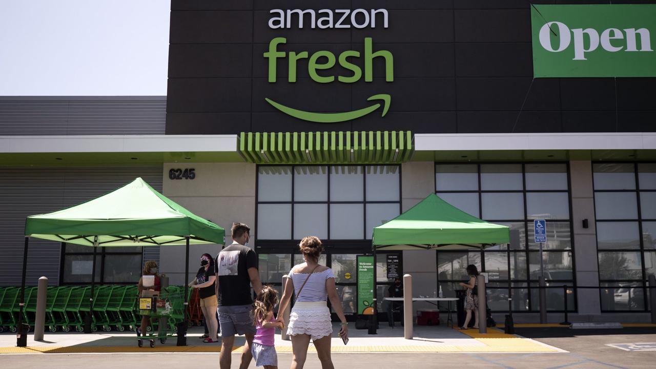 Mandatory Credit: Photo by ETIENNE LAURENT/EPA-EFE/Shutterstock (10758920g)A family arrives at the Amazon Fresh supermarket in Woodland Hills, California, USA, 28 August 2020.