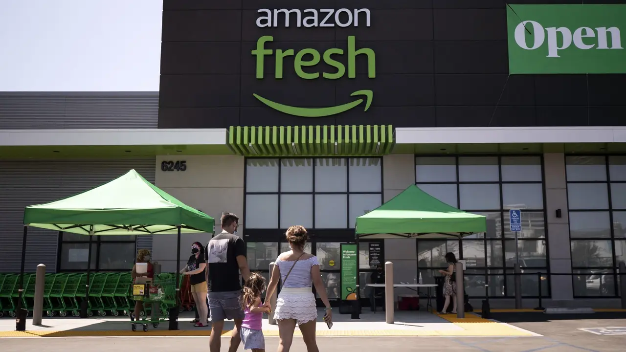 Mandatory Credit: Photo by ETIENNE LAURENT/EPA-EFE/Shutterstock (10758920g)A family arrives at the Amazon Fresh supermarket in Woodland Hills, California, USA, 28 August 2020.